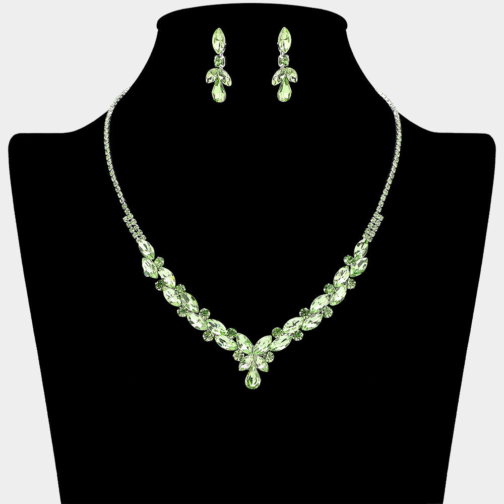 Light green marquise teardrop rhinestone cluster necklace set with matching earrings, all silver backed for prom and formal wear on a black mannequin bust. 