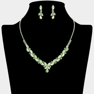 Light green marquise teardrop rhinestone cluster necklace set with matching earrings, all silver backed for prom and formal wear on a black mannequin bust. 