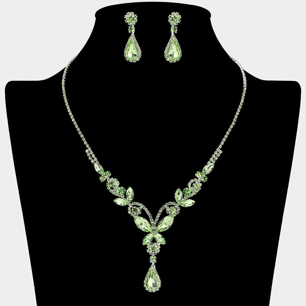 Light green teardrop butterfly rhinestone necklace set on silver displayed on black bust background