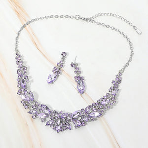 Violet Purple marquise stone cluster prom and evening necklace set on silver on white marble background
