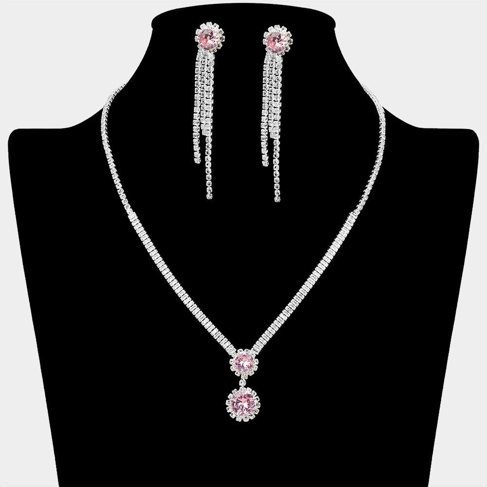 Light rose round CZ crystal drop necklace set with silver-tone rhinestone chain and matching long dangle earrings on a black display background