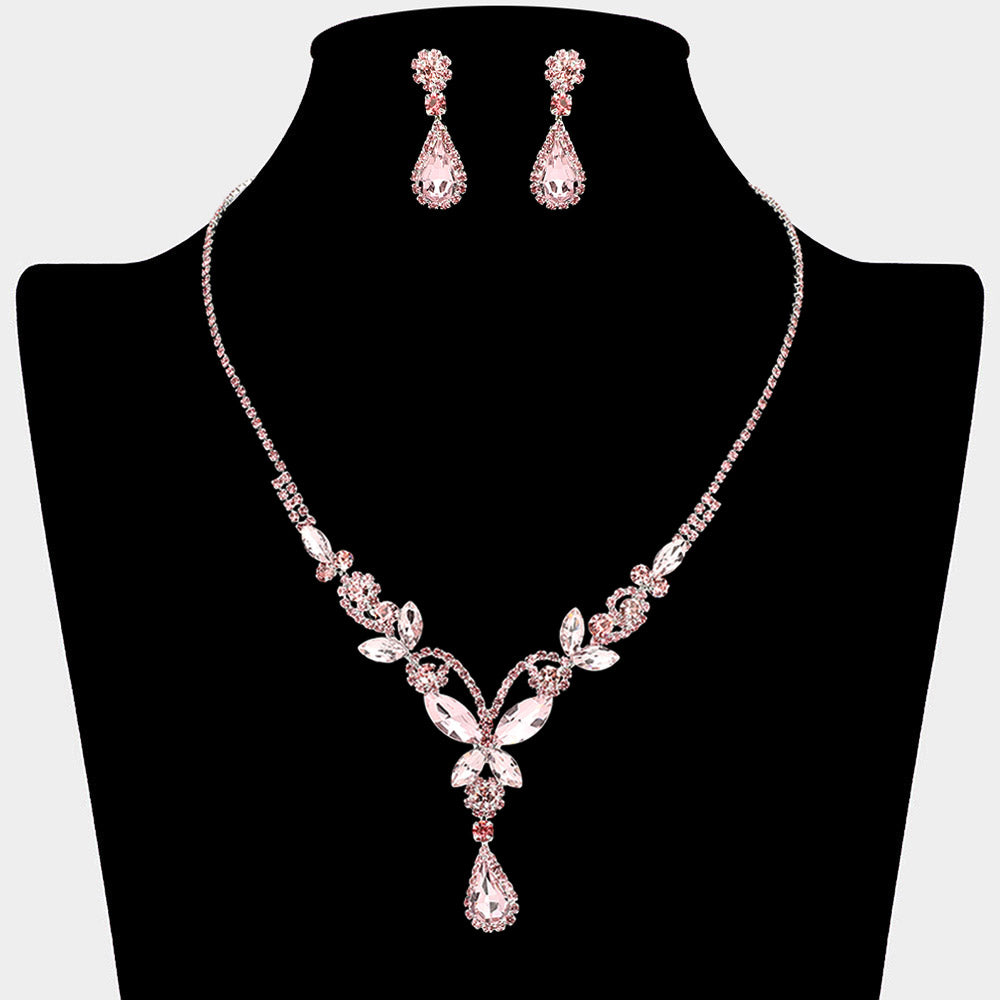 Light pink teardrop butterfly rhinestone necklace set on silver displayed on black bust background