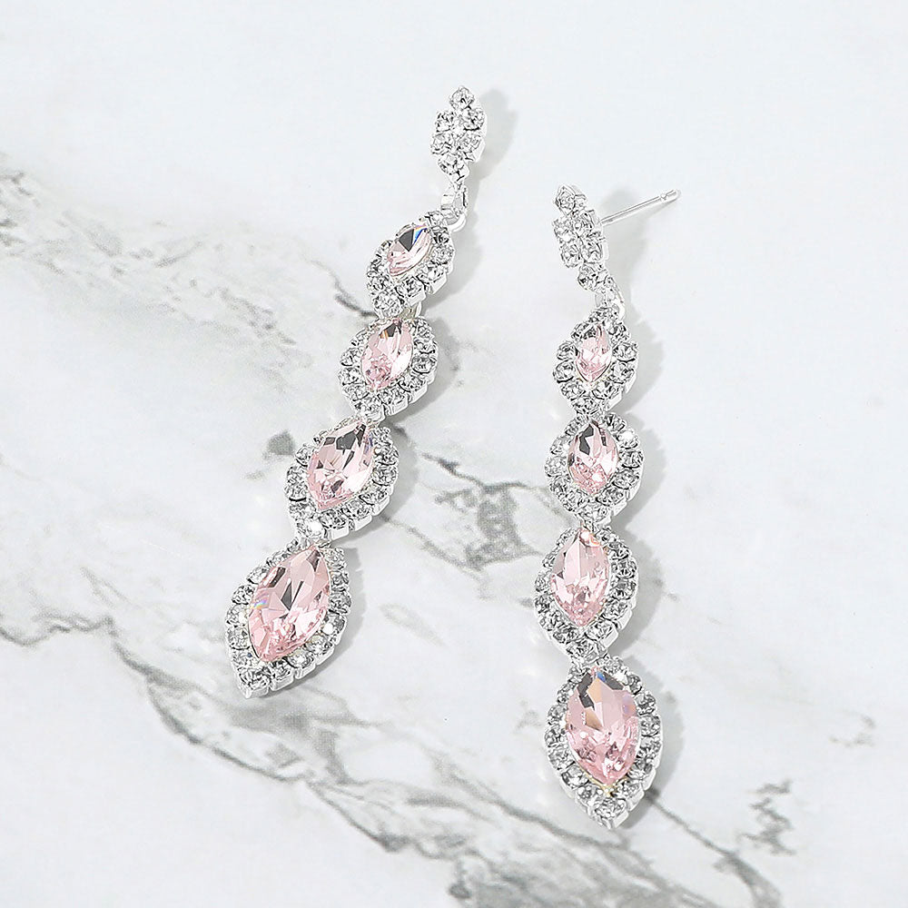 Light Pink vintage marquise stone link drop formal evening earrings on silver with rhinestones on white marble background