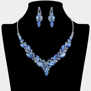 Light sapphire and royal blue marquise crystal cluster necklace set with matching earrings on silver backing for prom and evening wear on a black mannequin bust on a white background