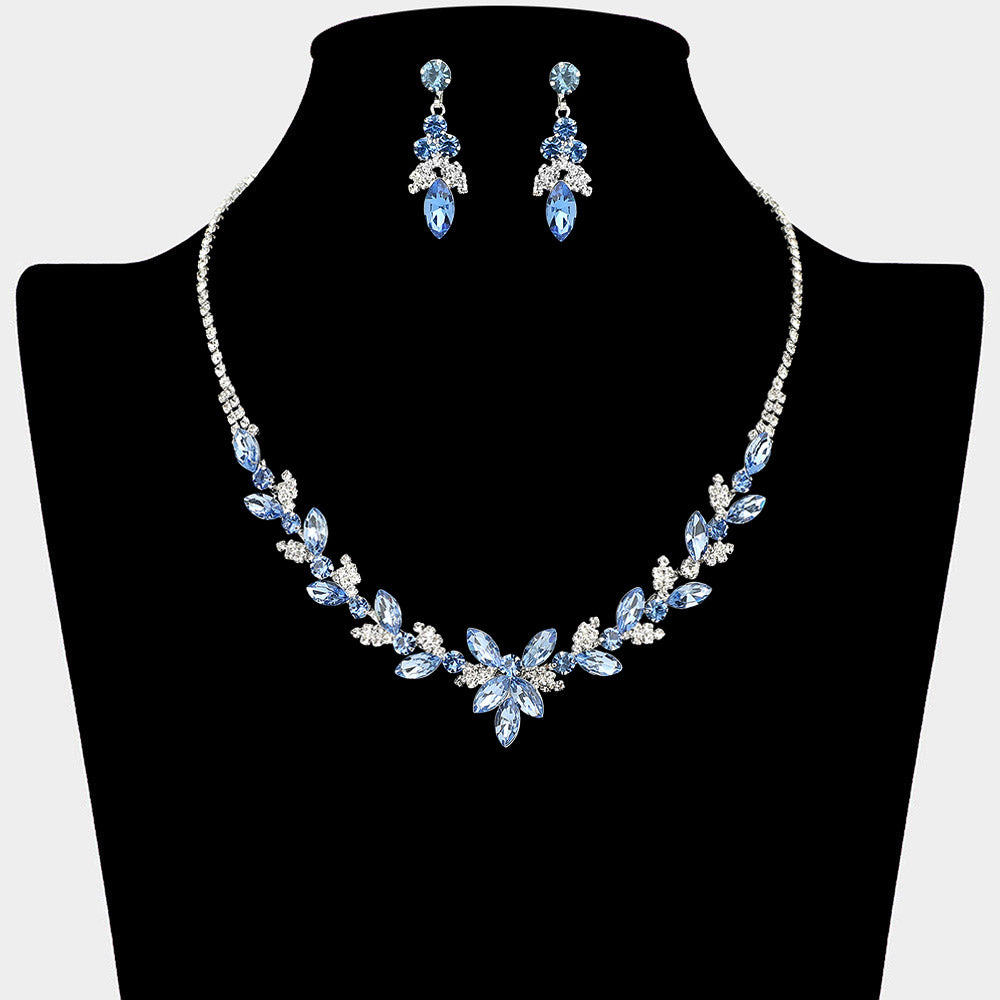 Light sapphire blue marquise floral rhinestone necklace set on silver displayed on black bust background