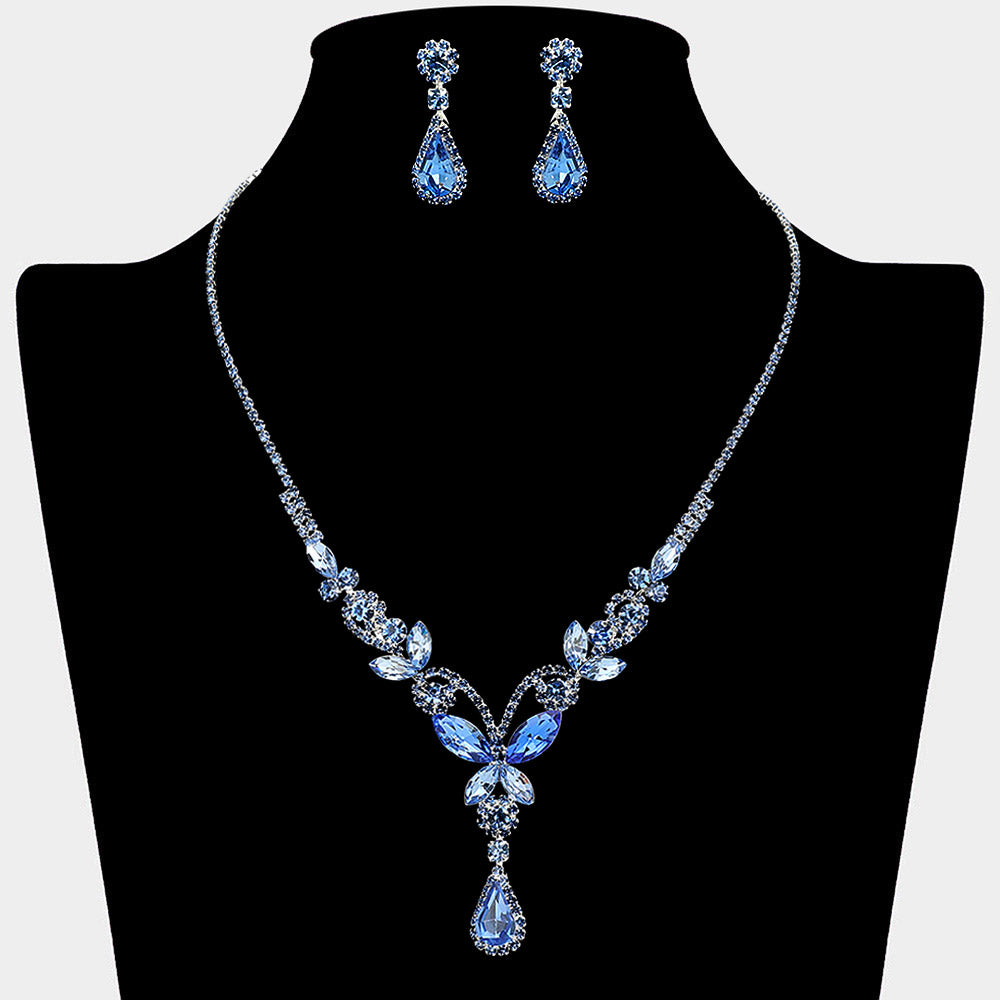 Light sapphire blue teardrop butterfly rhinestone necklace set on silver displayed on black bust background