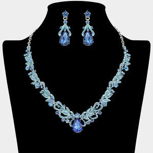 Light sapphire teardrop leaf crystal statement necklace set with matching earrings in a silver setting, shown on a black mannequin bust on a white background