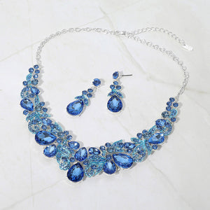 Light sapphire blue teardrop floral statement necklace set on silver displayed on white background