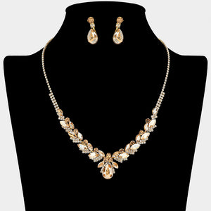 Light topaz teardrop marquise prom necklace set on gold with matching earrings displayed on a black mannequin bust on a white background.
