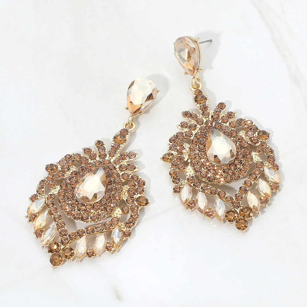 Champagne Gold Stone crystal teardrop chandelier statement pageant earrings on gold with an ornate layered crystal design, displayed on a white background.