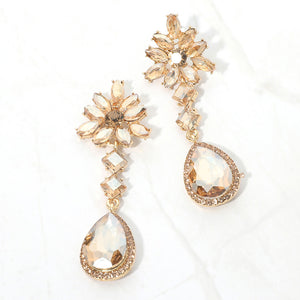 Champagne gold stone crystal flower teardrop earrings in a gold finish featuring marquise crystal flower tops and large faceted champagne teardrop drops, displayed on a white background.