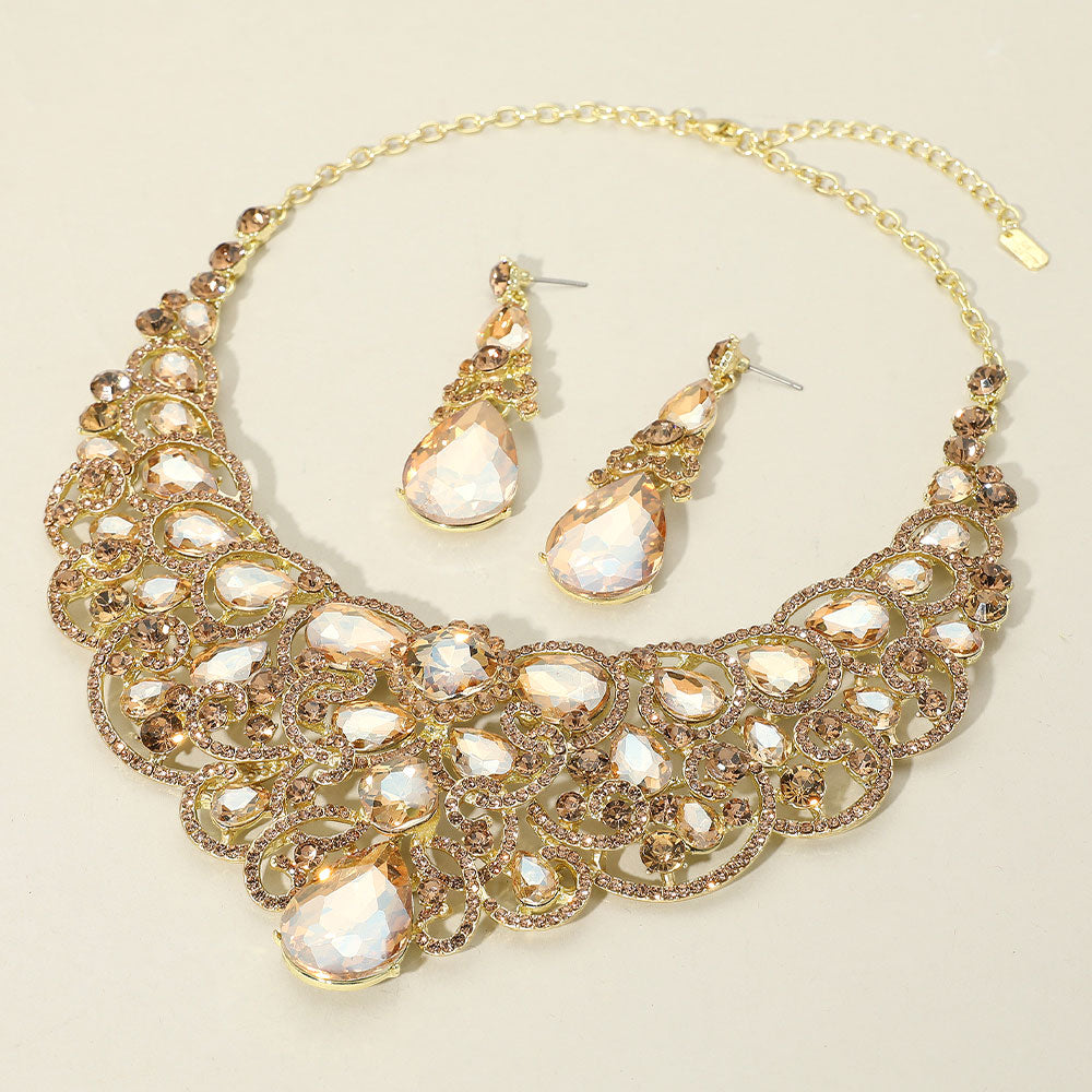 Light topaz gold stone teardrop statement collar necklace set with earrings for pageant or evening wear on an ivory background