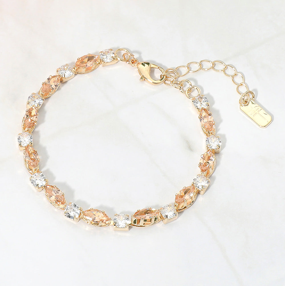 Gold Stone-Light Topaz marquise crystal prom bracelet on gold on white marble background