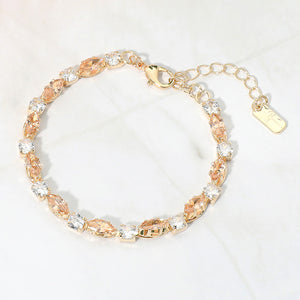 Gold Stone-Light Topaz marquise crystal prom bracelet on gold on white marble background