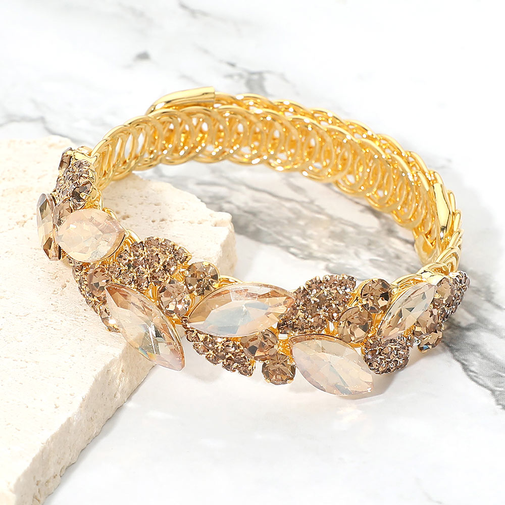 Gold Stone-Light Topaz marquise stone cluster adjustable bracelet on gold on marble surface