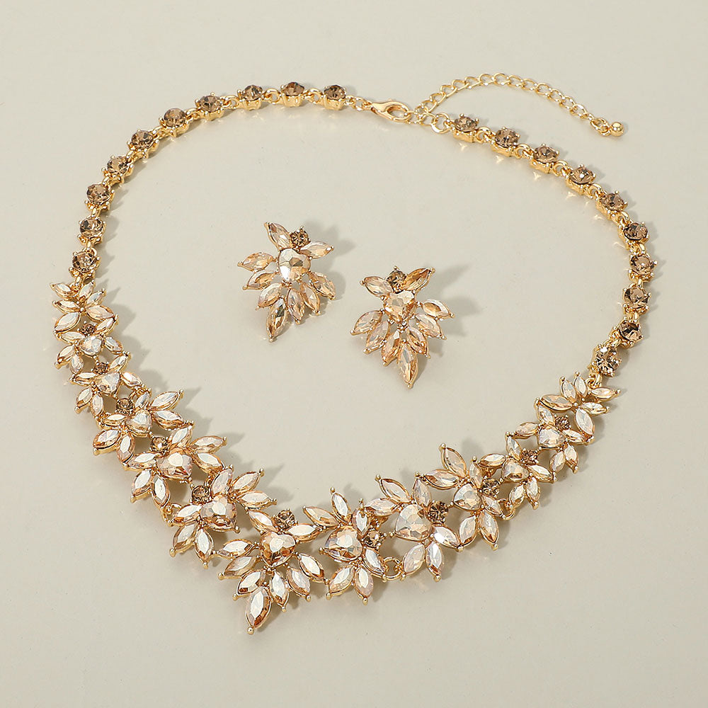 Gold stone (light topaz) marquise floral statement necklace set on gold on a beige background