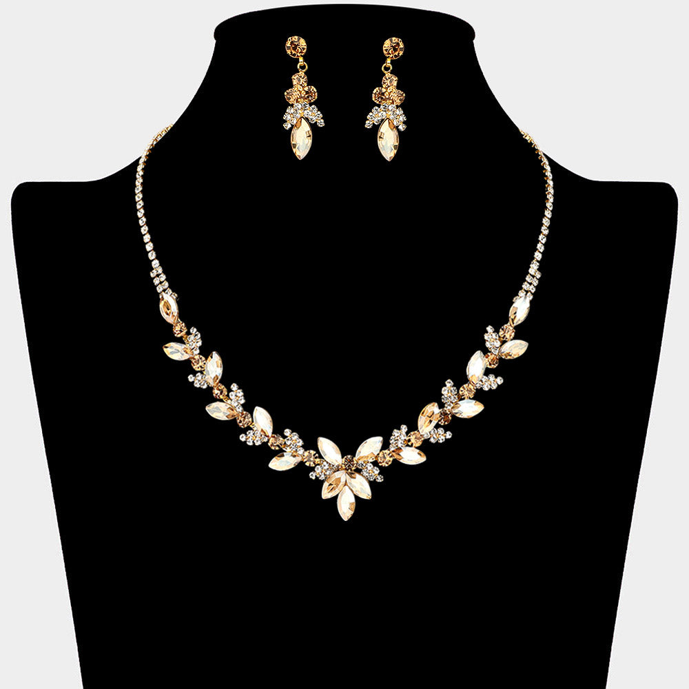 Light topaz marquise floral rhinestone necklace set on gold displayed on black bust background