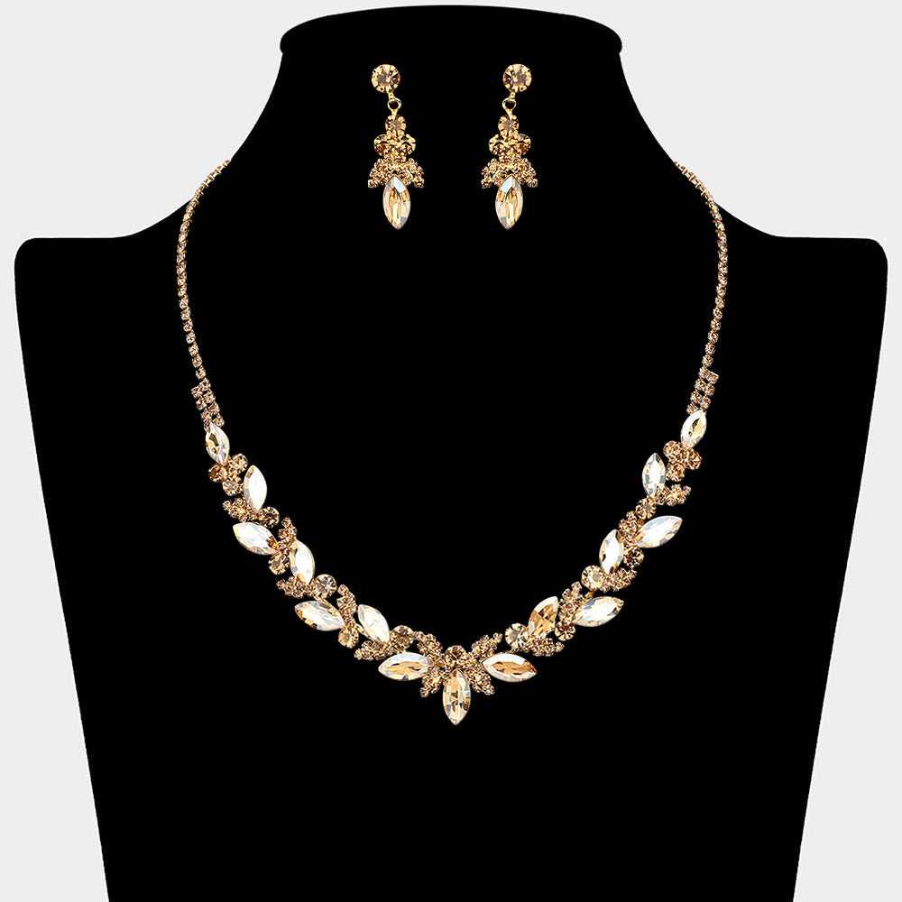 Light topaz gold stone marquise leaf rhinestone necklace set on gold displayed on black bust background