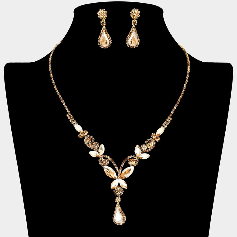 Light topaz gold stone teardrop butterfly rhinestone necklace set on gold displayed on black bust background
