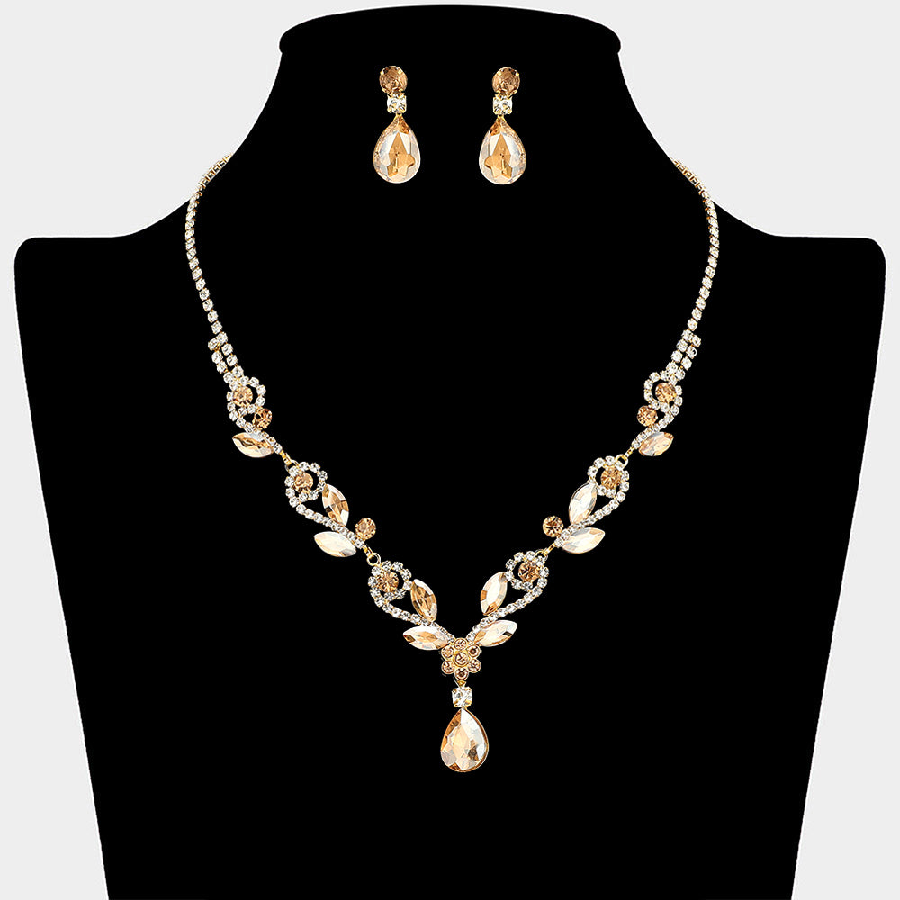 Light topaz teardrop marquise prom necklace set on gold with matching earrings displayed on a black mannequin bust on a white background.