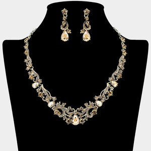 Light topaz-gold stone teardrop rhinestone cluster necklace set on gold with matching earrings for prom and formal wear. Shown here on a black mannequin bust.
