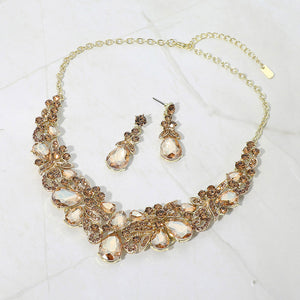 Light topaz gold stone teardrop floral statement necklace set on gold displayed on white background