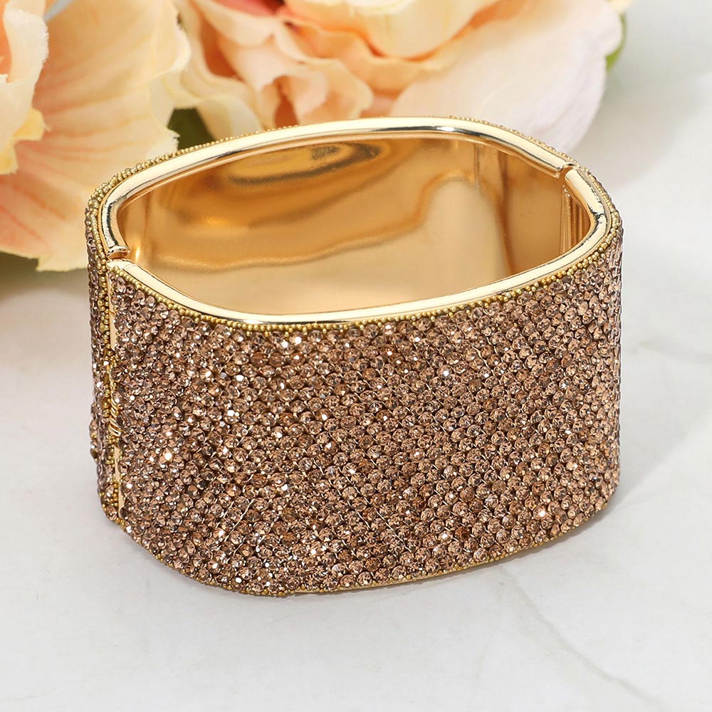 Light topaz gold stone wide rhinestone hinged bangle bracelet with a chunky statement silhouette and polished gold-tone setting