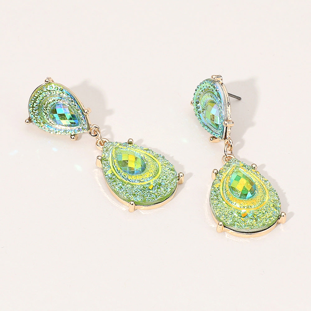 Lime Green crystal glitter teardrop drop earrings on gold on light beige background