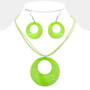 Lime Green open-circle necklace set on silver with an oversized round pendant and matching open-circle earrings, displayed on a white jewelry bust.