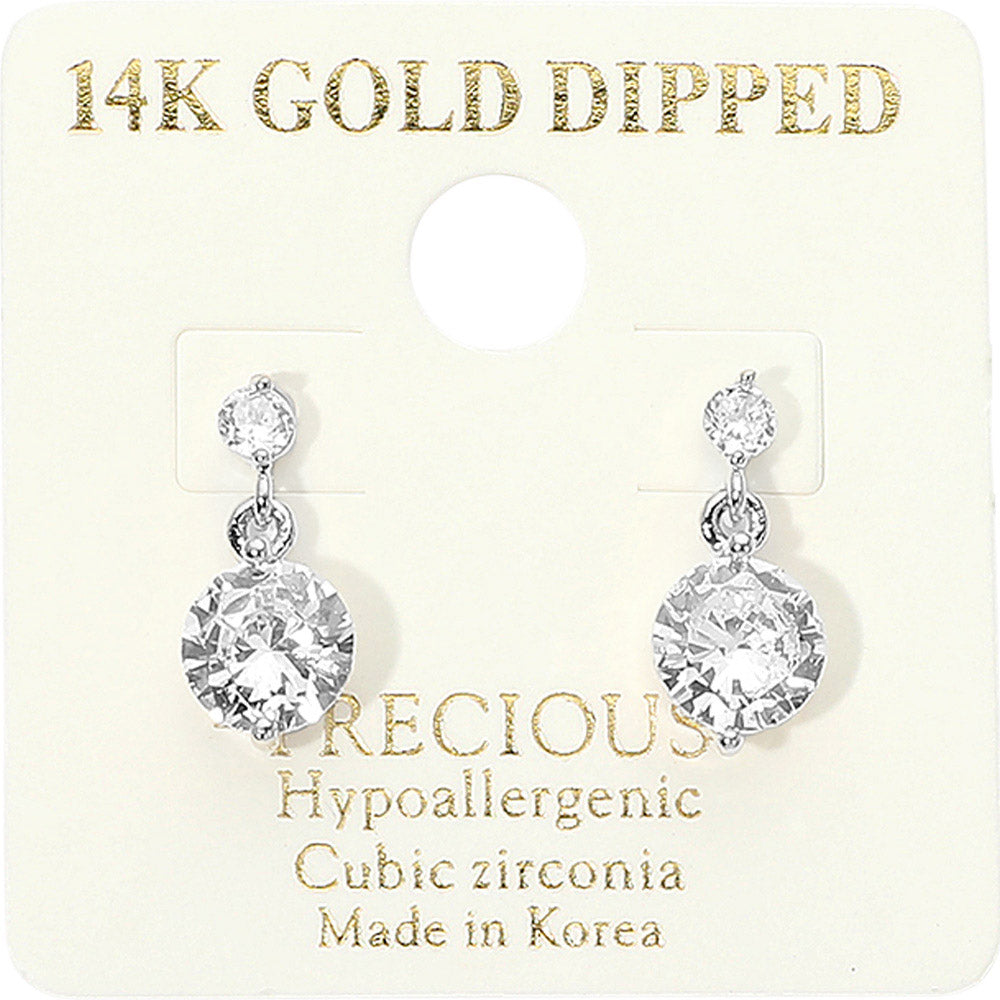 Little Girls' clear crystal round drop earrings on silver featuring a smaller round crystal suspended above a larger round crystal, displayed on a off white jewelry card.