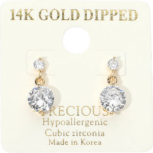 Little Girls clear crystal round drop earrings on gold featuring a smaller round crystal suspended above a larger round crystal, displayed on a white jewelry card.