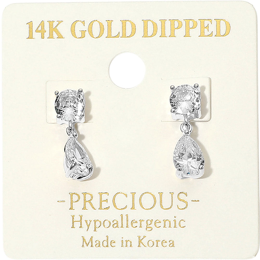 Little girls clear crystal teardrop drop earrings in a silver finish with square crystal studs and small teardrop dangles, displayed on a white jewelry card with gold lettering.