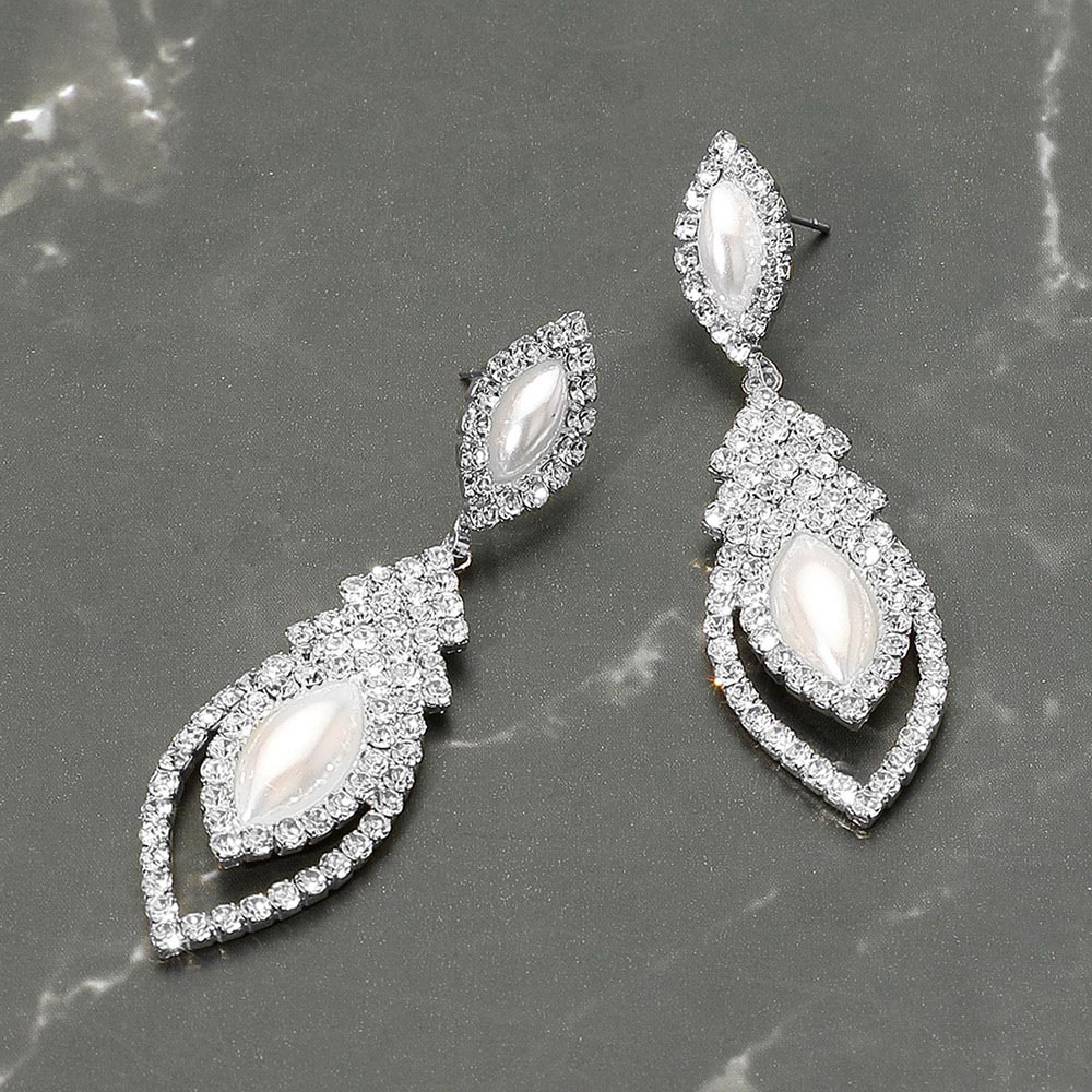 Marquise white pearl and clear crystal dangle earrings on silver — elegant cascading bridal and evening jewelry perfect for weddings or prom. Shown here on a grey marble background.