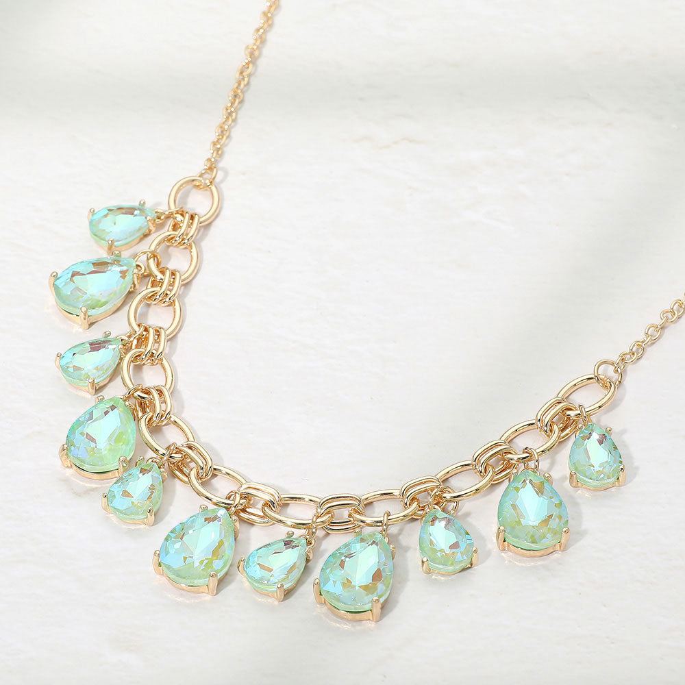 Mint AB crystal teardrop statement necklace on gold on white background