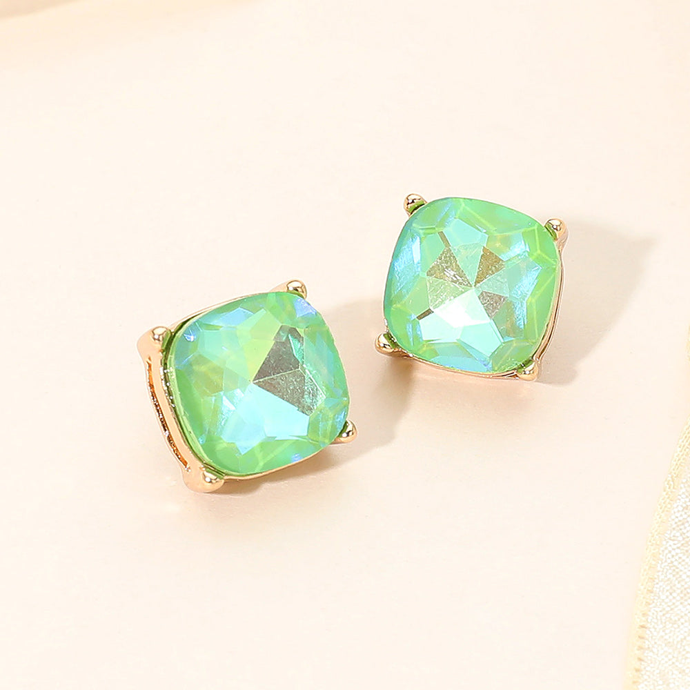 Mint AB square cushion stud earrings on gold on light beige background