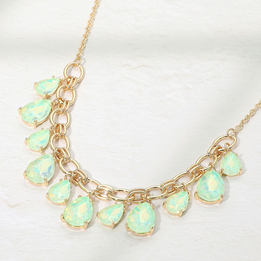 Mint opal crystal teardrop statement necklace on gold on white background