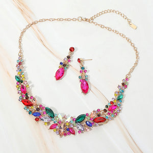 Multi-color marquise stone cluster prom and evening necklace set on gold on white marble background