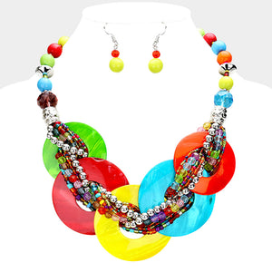 Multi-color chunky round link statement necklace set with matching earrings on white bust