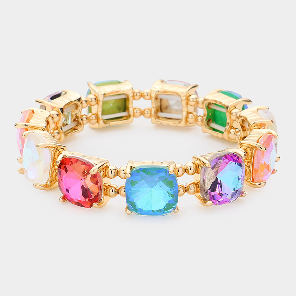Multi-color AB cushion square stone stretch evening bracelet on gold, iridescent statement bracelet on a white background