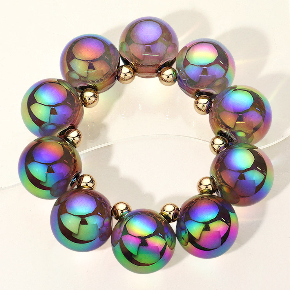Chunky multi-color iridescent balls/spheres bracelet on a white background