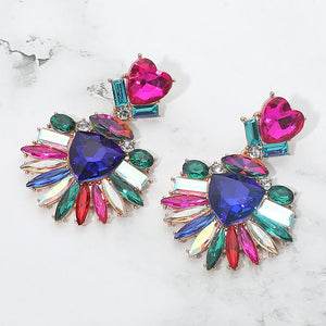 Multi-Color Heart Crystal Fan pageant and prom earrings on gold displayed on a white marble background
