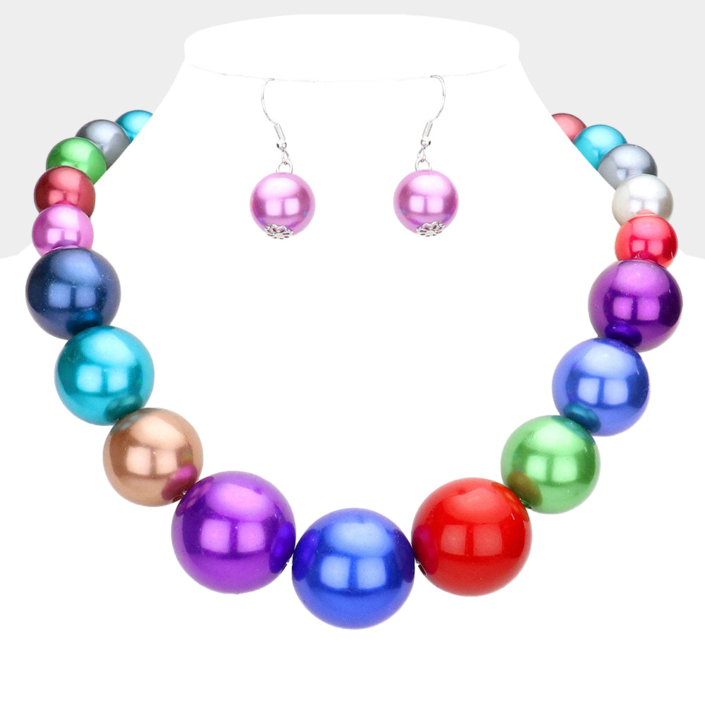 Multi color jewel tones Oversized Graduated Pearl Glossy Statement Necklace Set on silver on a white background.
