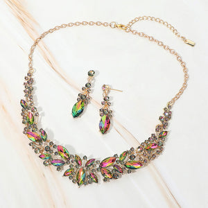 Multi-color marquise stone cluster prom and evening necklace set on gold on white marble background