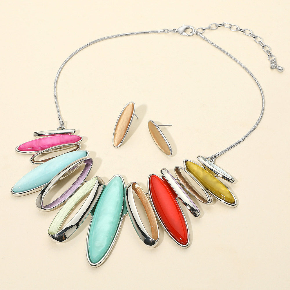 Multi-Color metal marquise stones statement necklace on a white mannequin bust