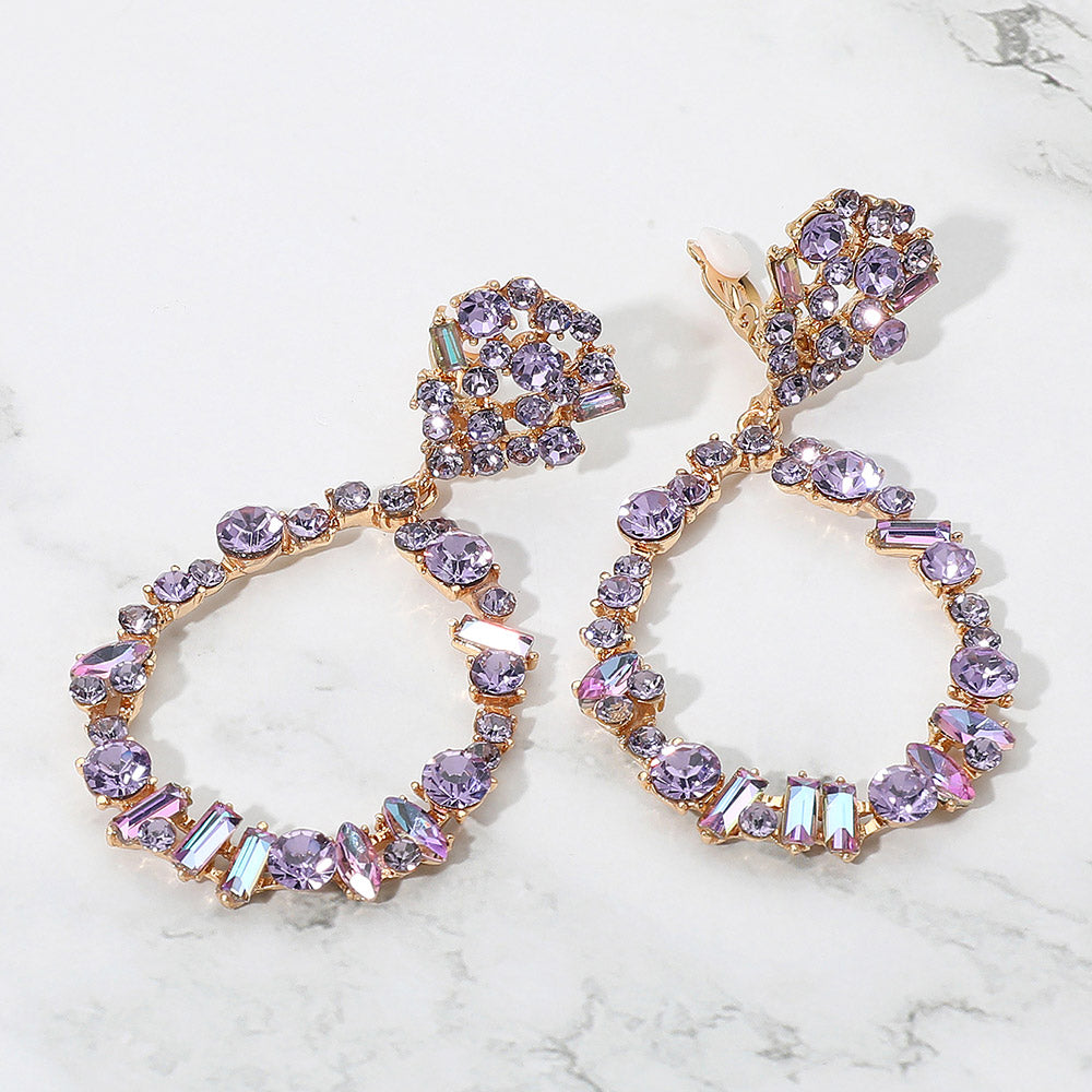 Multi-color mixed stone cluster open teardrop clip-on pageant earrings on gold on a white background