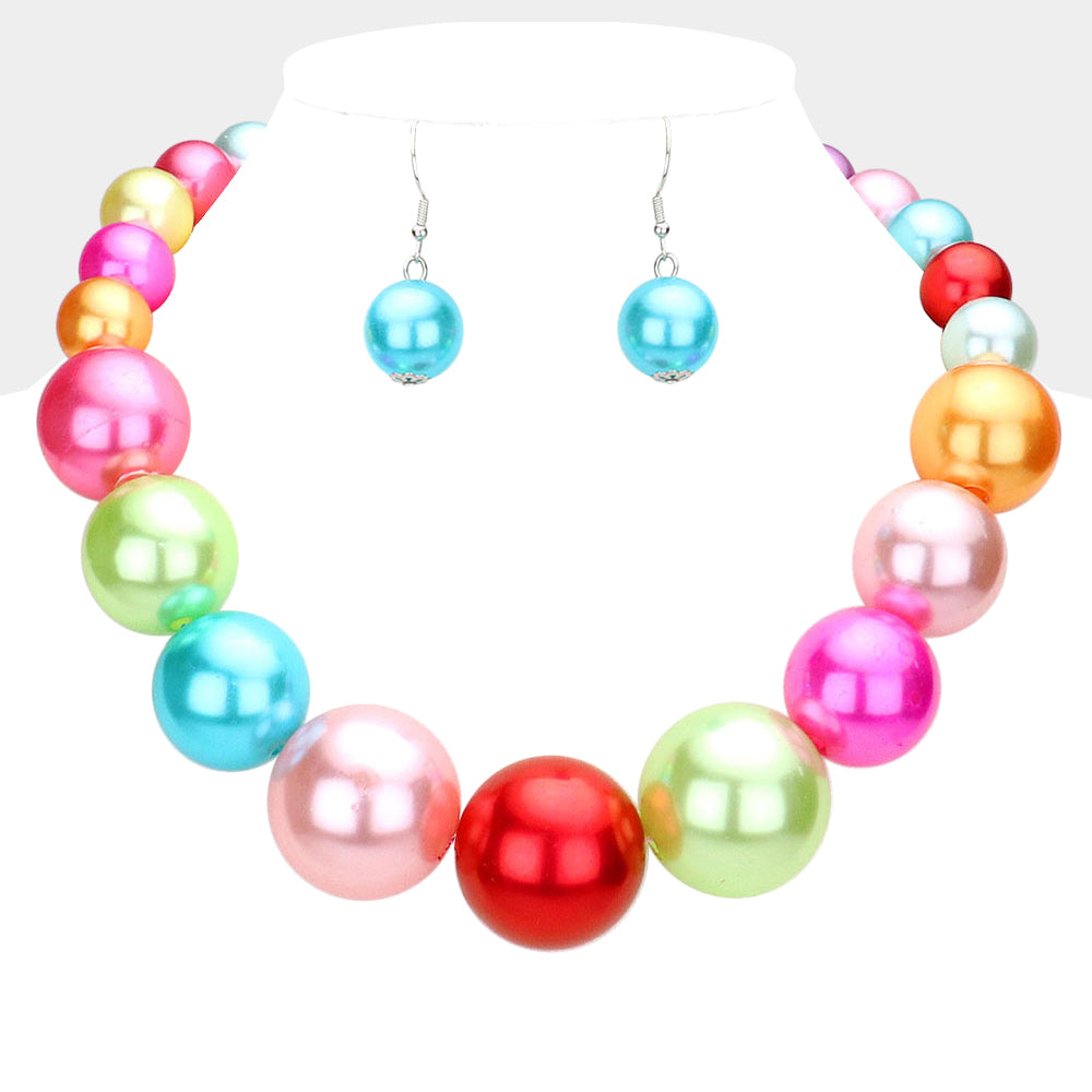 Multi colored pastels Oversized Graduated Pearl Glossy Statement Necklace Set on silver on a white background.