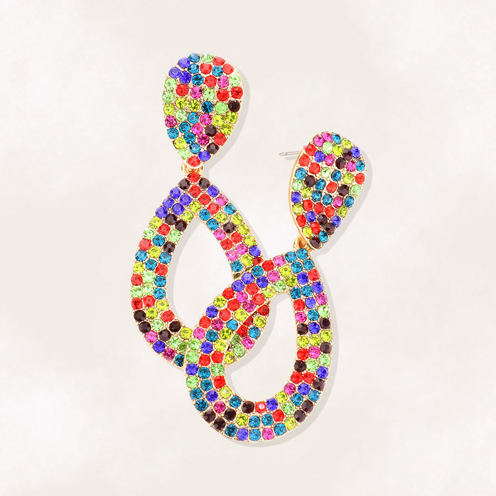 Multi-color rhinestone pavé cut out teardrop pageant and formal earrings on a beige background