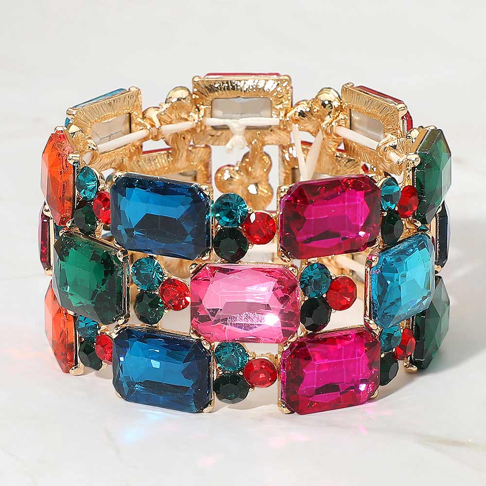 Multi-Color jewel tones wide emerald cut crystal stretch bracelet on gold on white background