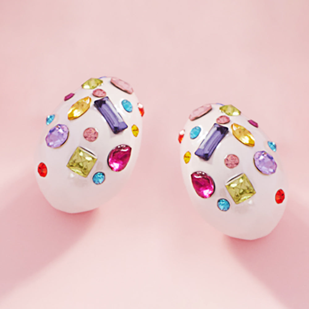 Multi color stone teardrop earrings on white with vibrant mixed crystals, 1.25 inch drop earrings on a pink background