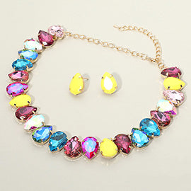Multi-color teardrop prom necklace and earrings set on light beige background